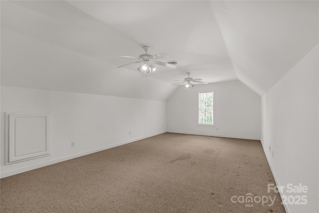bonus room with light carpet, baseboards, a ceiling fan, and lofted ceiling