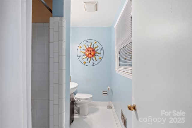 bathroom featuring toilet and visible vents