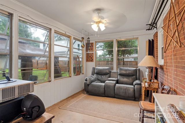 sunroom / solarium with a ceiling fan