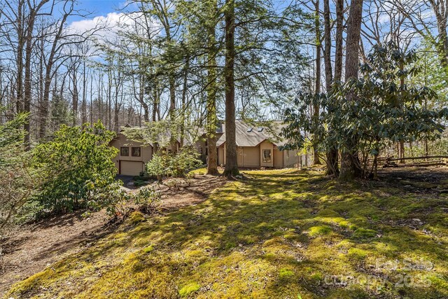 view of yard featuring an attached garage