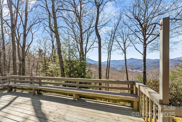 wooden terrace with a mountain view