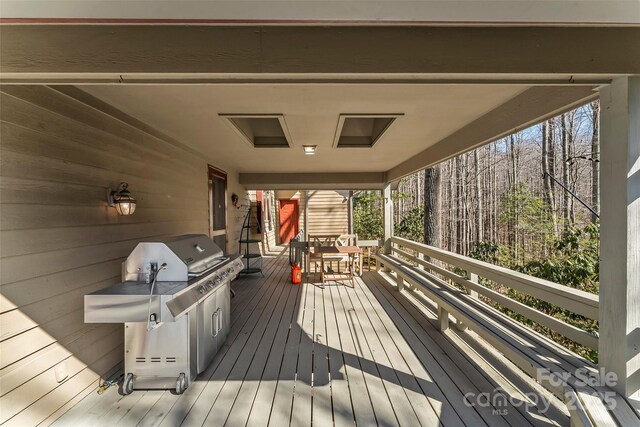 deck featuring a grill