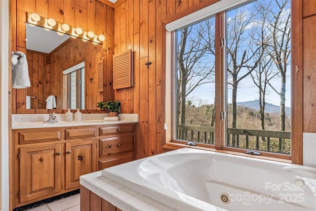 243 Red Oak Trl, Boone, NC 28607 - bathroom with plenty of natural light, a whirlpool tub, vanity, and wooden walls