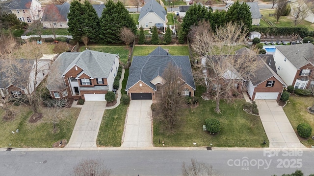 birds eye view of property with a residential view