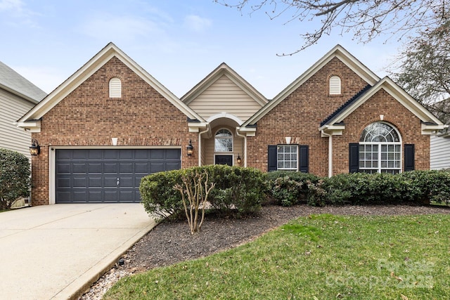 view of front facade with a garage, concrete driveway, and brick siding