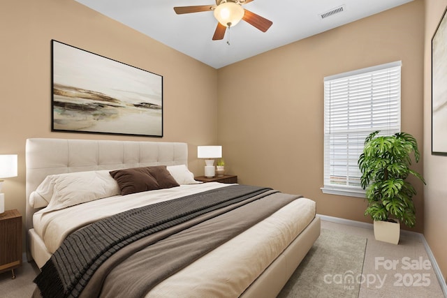 bedroom with baseboards, visible vents, ceiling fan, and carpet flooring