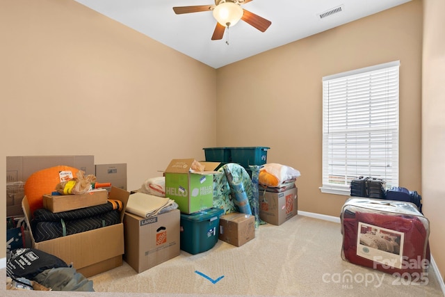 storage room with visible vents and a ceiling fan