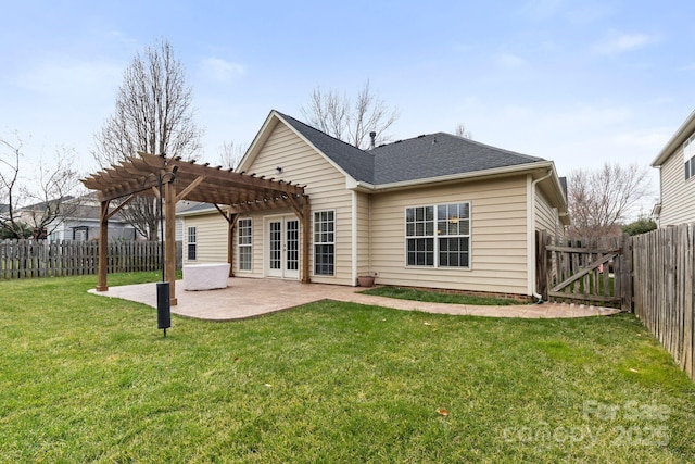 back of house with a yard, a fenced backyard, a pergola, and a patio