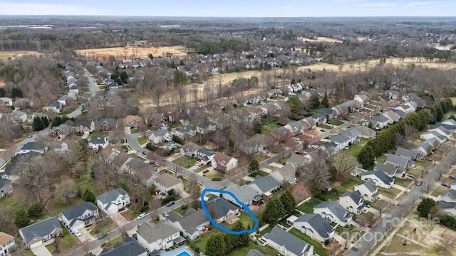 birds eye view of property with a residential view