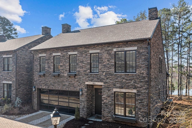 view of front of house featuring a chimney