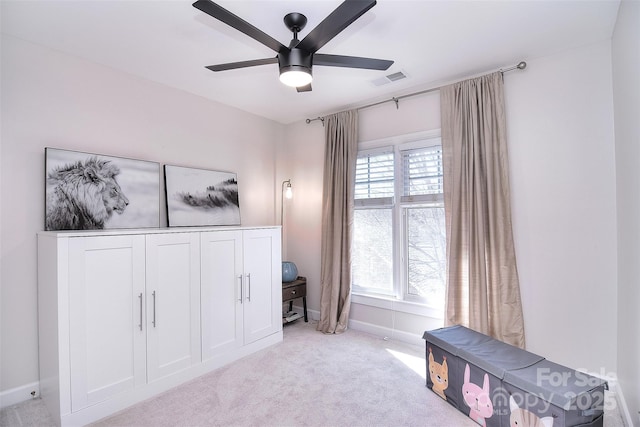 bedroom with carpet floors, visible vents, ceiling fan, and baseboards