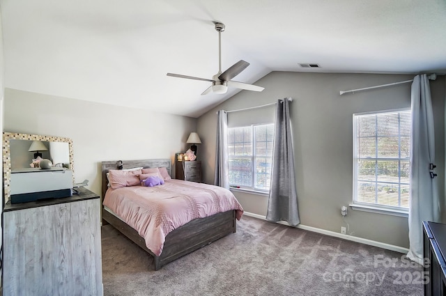 bedroom featuring carpet floors, lofted ceiling, visible vents, and multiple windows