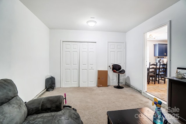 living area with light colored carpet