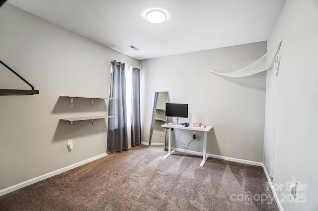 unfurnished office featuring visible vents, baseboards, and carpet flooring