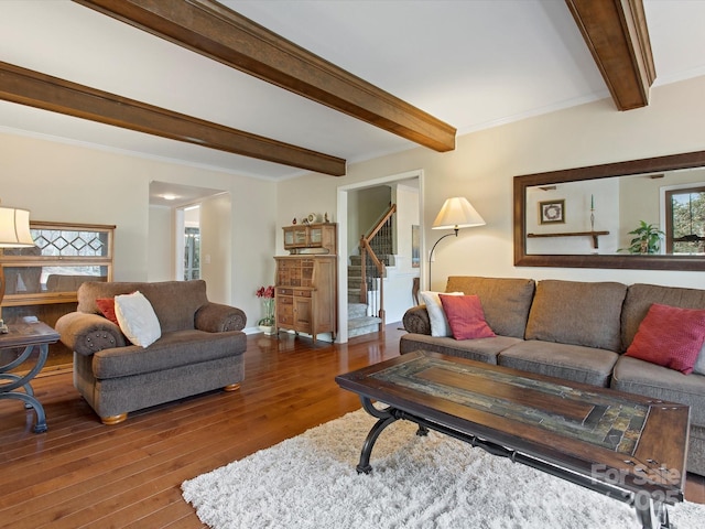 living room with stairs, beam ceiling, hardwood / wood-style flooring, and crown molding