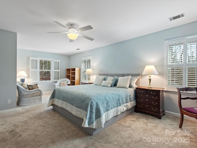 bedroom featuring baseboards, visible vents, carpet floors, and ceiling fan