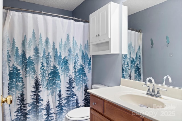 full bath with a textured ceiling, vanity, toilet, and a shower with curtain