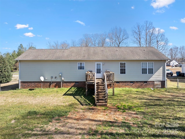 rear view of property with a yard, stairway, crawl space, fence, and a wooden deck