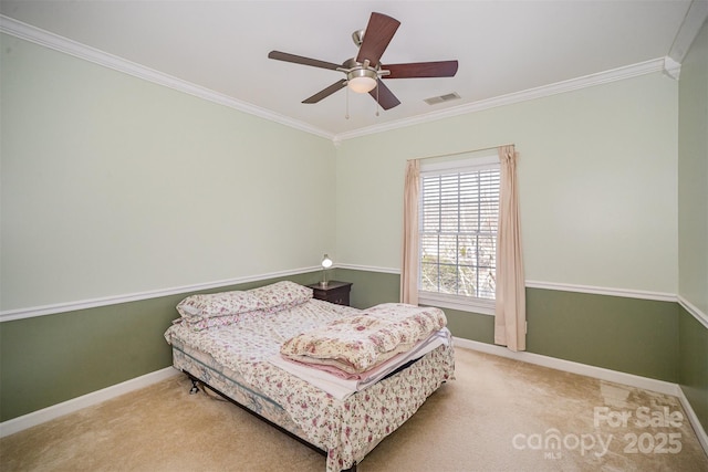 bedroom with baseboards, carpet floors, visible vents, and crown molding