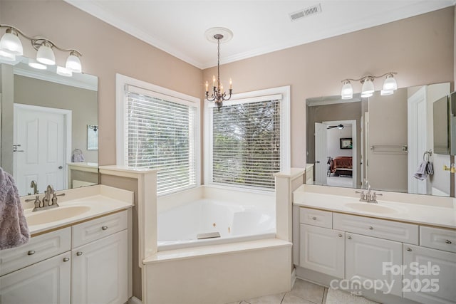 ensuite bathroom featuring crown molding, a sink, visible vents, and connected bathroom