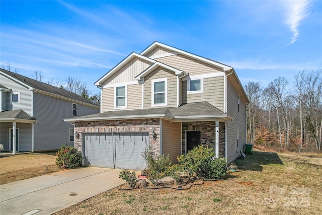 view of front of home featuring concrete driveway, an attached garage, board and batten siding, a front yard, and stone siding