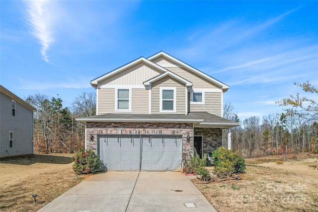 view of front of home featuring a garage, driveway, board and batten siding, and stone siding