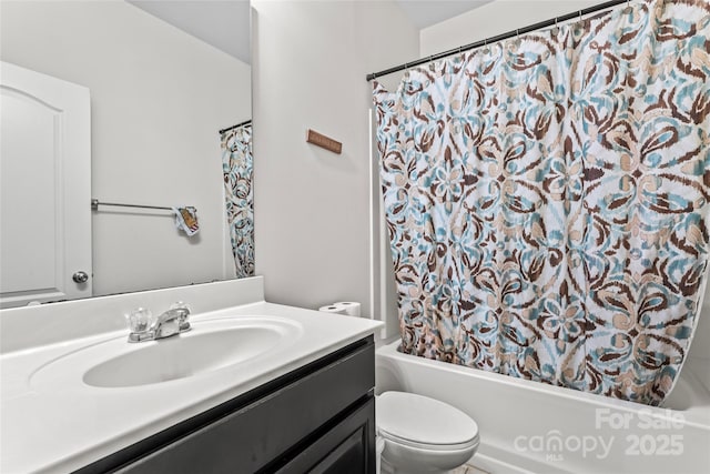 full bathroom featuring shower / bath combo, vanity, and toilet