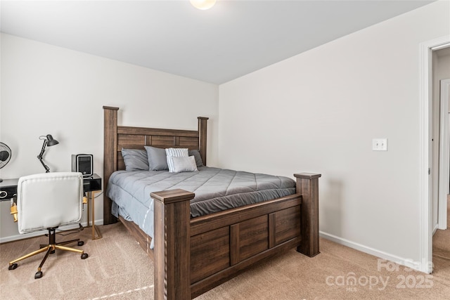 bedroom with carpet flooring and baseboards