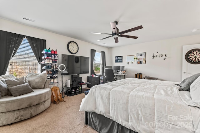 bedroom featuring carpet flooring, visible vents, and a ceiling fan