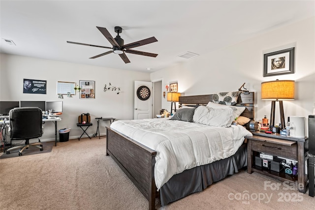 bedroom featuring a ceiling fan, light colored carpet, visible vents, and baseboards