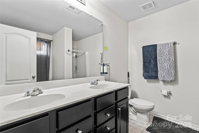 bathroom with visible vents, a sink, and toilet