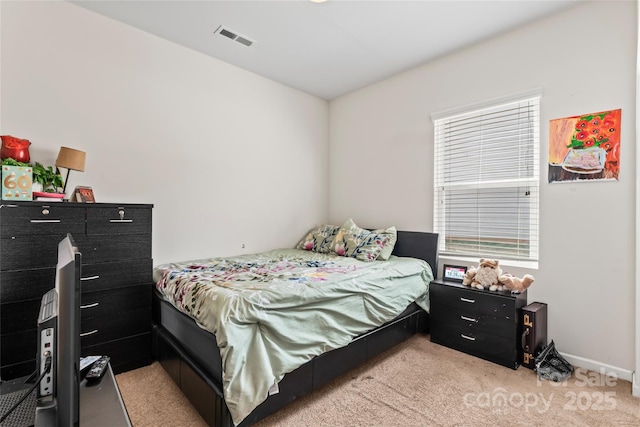 bedroom featuring light carpet, multiple windows, and visible vents