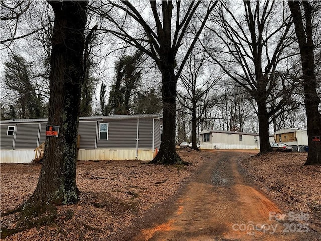 view of property exterior featuring driveway