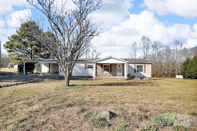 single story home with a carport, a front yard, and driveway