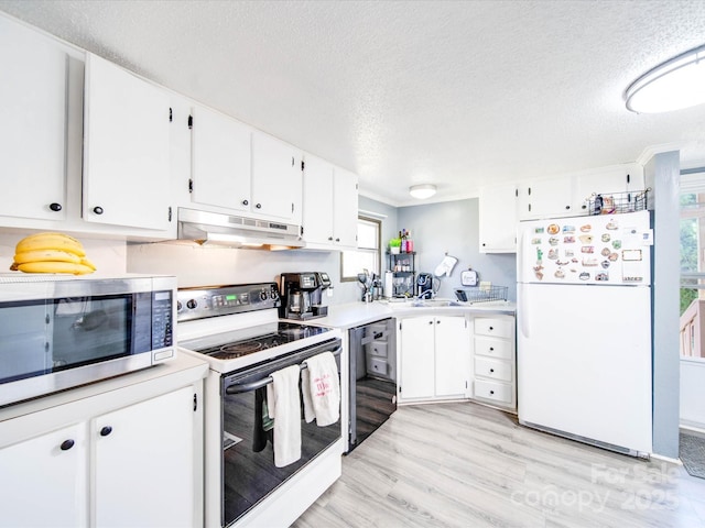 kitchen featuring under cabinet range hood, white cabinetry, white appliances, light wood-style floors, and light countertops