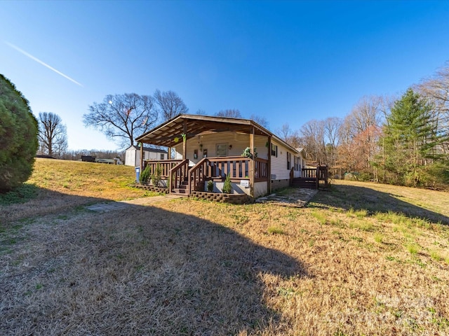 exterior space featuring a deck, a storage shed, an outdoor structure, and a lawn