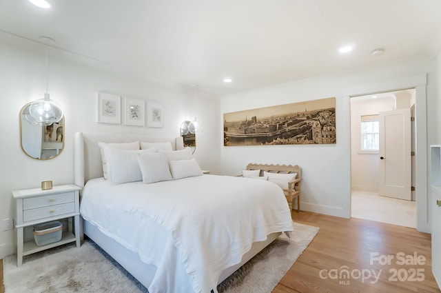 bedroom featuring recessed lighting, baseboards, and light wood-style floors