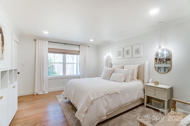 bedroom with recessed lighting, baseboards, and light wood finished floors