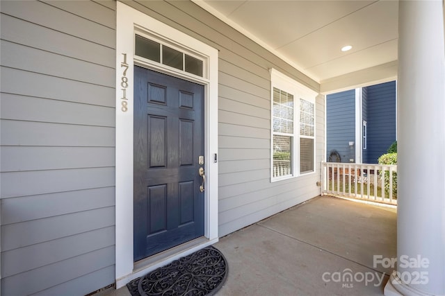 doorway to property with covered porch