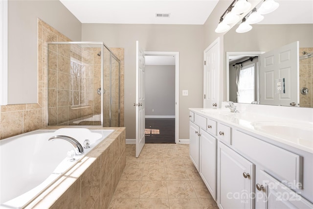 bathroom with double vanity, visible vents, a stall shower, a sink, and a bath