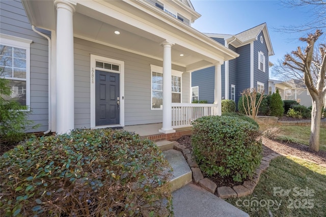 doorway to property with covered porch