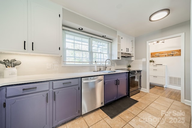 kitchen with under cabinet range hood, electric range, a sink, visible vents, and dishwasher