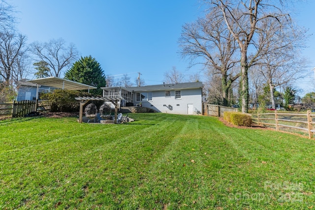 view of yard featuring a fenced backyard and a pergola