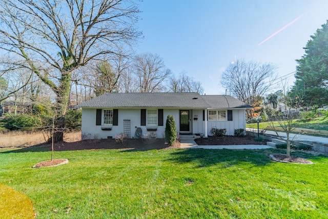 single story home featuring a front lawn, board and batten siding, and brick siding