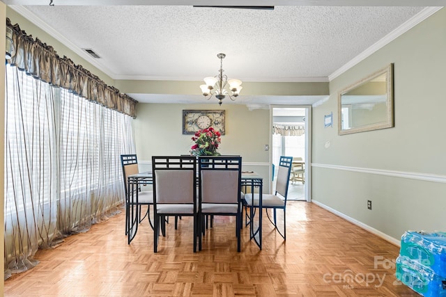 dining space with baseboards, visible vents, a chandelier, and a textured ceiling