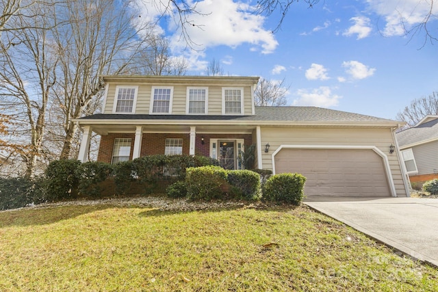 view of front facade featuring brick siding, covered porch, a front yard, a garage, and driveway