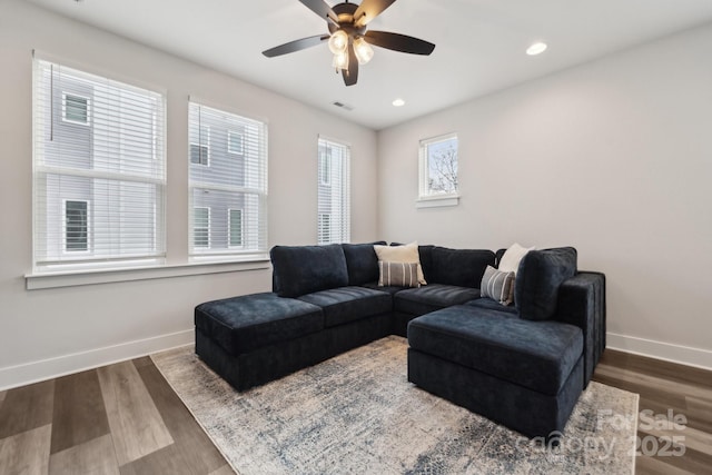 living area featuring recessed lighting, wood finished floors, a ceiling fan, visible vents, and baseboards