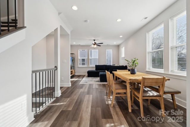 dining area featuring dark wood finished floors, a wealth of natural light, and recessed lighting