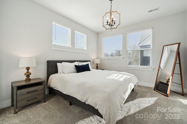 bedroom featuring carpet, baseboards, visible vents, and a chandelier