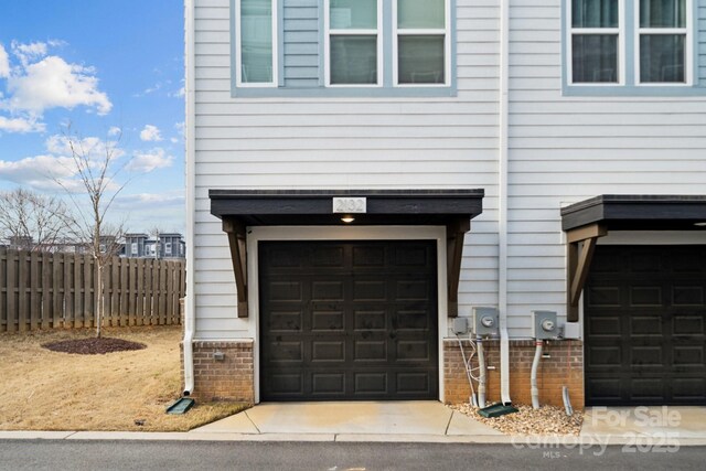 garage featuring fence